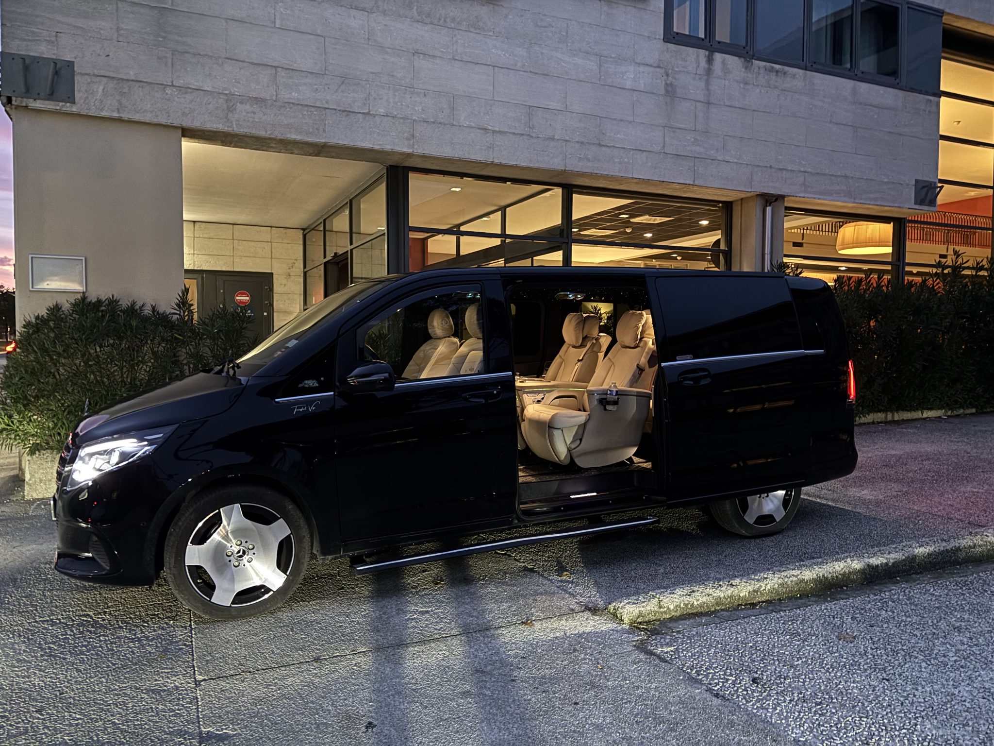 Black Mercedes VIP Class with private driver outside a hotel, transfers to Val Thorens